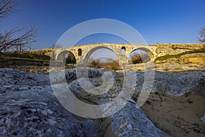 Pont Julien, roman stone arch bridge over Calavon river, Provence, France