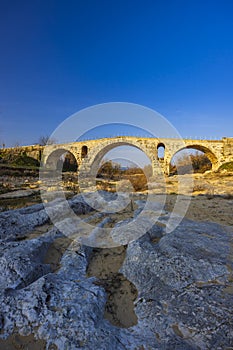 Pont Julien, roman stone arch bridge over Calavon river, Provence, France