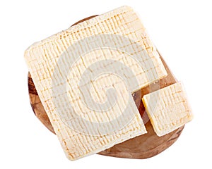 Pont-L`eveque cheese isolated on white. Soft French cow`s milk cheese from Normandy. Top view