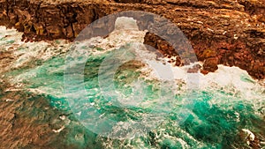 Pont Naturel, Mauritius Island. Beautiful arch rock formation from a drone viewpoint