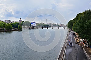 The Pont Neuf is, despite its name, the oldest existing bridge in Paris. In the background, the Eiffel photo