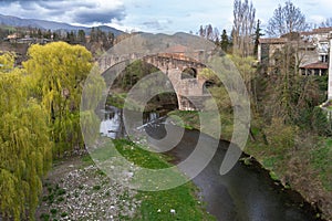 Pont vell in the village of Sant Joan de les Abadesses in Spain photo