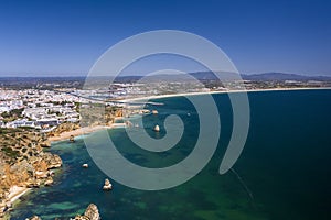 Ponta da Piedade - Portuguese southern golden coast cliffs. Aerial view over city of Lagos in Algarve