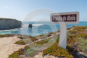 Ponta do Trovao coast in Peniche, Leiria, Portugal with a signage near it