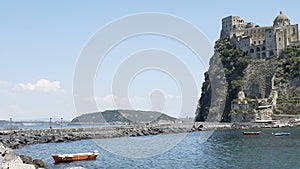 Ponte Aragonese connecting castle with Ischia island, sightseeing tour to Italy