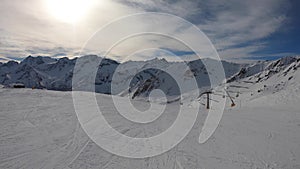 Ponte di Legno, Tonale, Italy. Skiing on the slopes in a wonderful day. POV from the skier. Point of view from the ski helmet