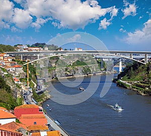Ponte do Infante, Maria Pia Bridge and St John`s Bridge over Douro river in Porto, Portugal. People are unrecognizable