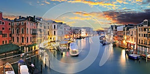 Ponte Rialto and gondola at sunset in Venice, Italy