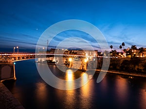 Ponte San Francesco di Paola bridge and Castello Aragonese castle in Taranto, Italy at night