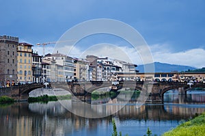 Ponte Santa Trinita arch bridge over river Arno in Florence, Italy