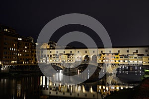 Ponte Vecchio and Arno river by night