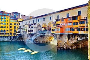 The Ponte Vecchio bride in Florence italy stretches over the arno river