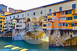 The Ponte Vecchio bridge in Florence italy stretches over the arno river