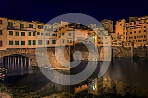 Ponte Vecchio bridge with silversmith shops on Arno at sunset, Florence, Italy