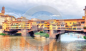 Ponte Vecchio by day and Arno river, Florence, Italy