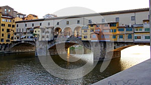 Ponte Vecchio, `Old Bridge`, over the Arno River, sunset view, Florence, Italy