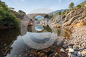 Ponte Vecchiu bridge over Fango river in Corsica photo