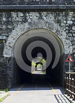 Ponteba Italy July 24th 2018. Ciclovia Alpe Adria placed on former rail way. Old train tunnel on a sunny day. Radweg in Italy