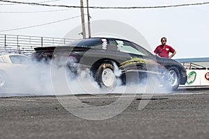 Pontiac drag car making a smoke show