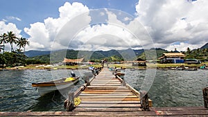 Pontoon and boats in Alotau, Papua New Guinea photo