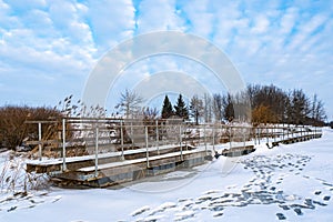 Pontoon bridge on ice in winter