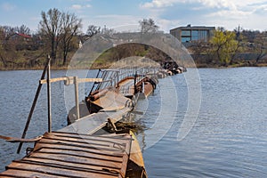 Pontoon-bridge over small river Sura to remote Ukrainian village Rakshivka