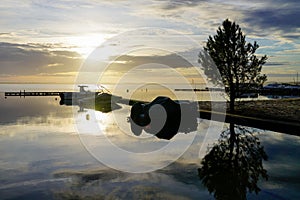 Pontoon pier in yellow night sunset in lake of biscarrosse in landes france