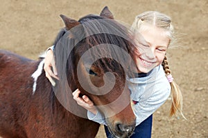 Pony and little girl and her best friend