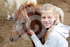 Pony and little girl and her best friend