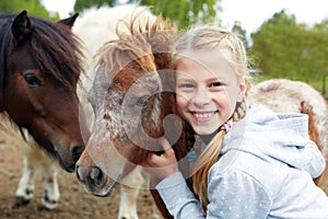 Pony and little girl and her best friend