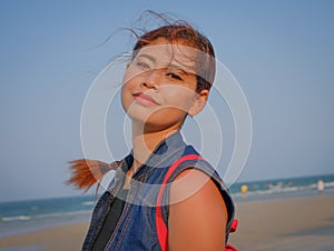 Pony-tailed model looking directly at camera.