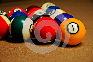 Pool balls on a billiard table.