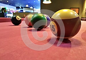 Pool balls on pink baize