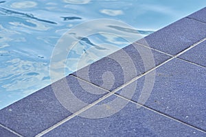 Pool with black stone bar