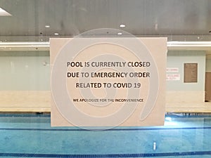 Pool is closed due to covid sign on swimming pool