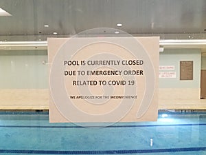 Pool is closed due to covid sign on swimming pool