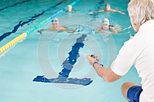 Pool coach - swimmer training competition