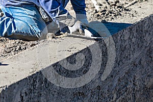 Pool Construction Worker Working With Wood Float On Wet Concrete