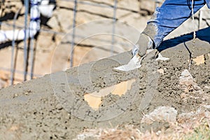 Pool Construction Worker Working With Wood Float On Wet Concrete