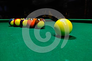 Pool cues close-up on a green table for playing