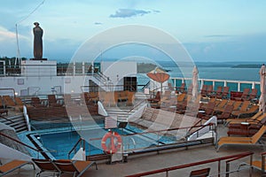 Pool on deck of cruise liner in evening