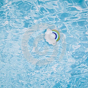 Pool float for children, ring floating in a refreshing blue pool