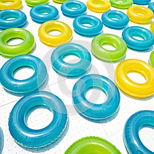 Pool float rings grid pattern isolated on white background