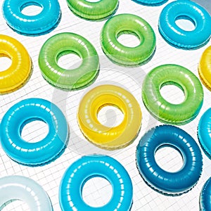 Pool float rings grid pattern isolated on white background