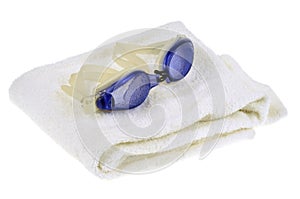 Pool glasses resting on a bath towel