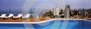 pool in a luxurious hotel in miraflores in the background beach in the pacific ocean lima peru photo