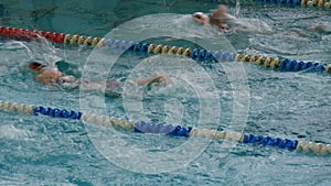Pool with many special tracks. Women`s Freestyle Swimming training