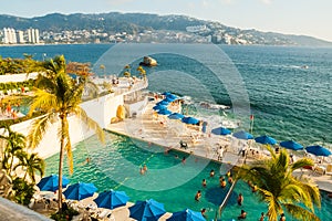 Pool by the ocean in Acapulco bay, Acapulco Mexico.