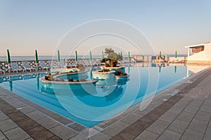 Pool overlooking the Mediterranean Sea in Puglia, Italy photo