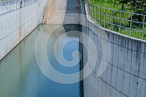 Pool of placid water at bottom of spillway